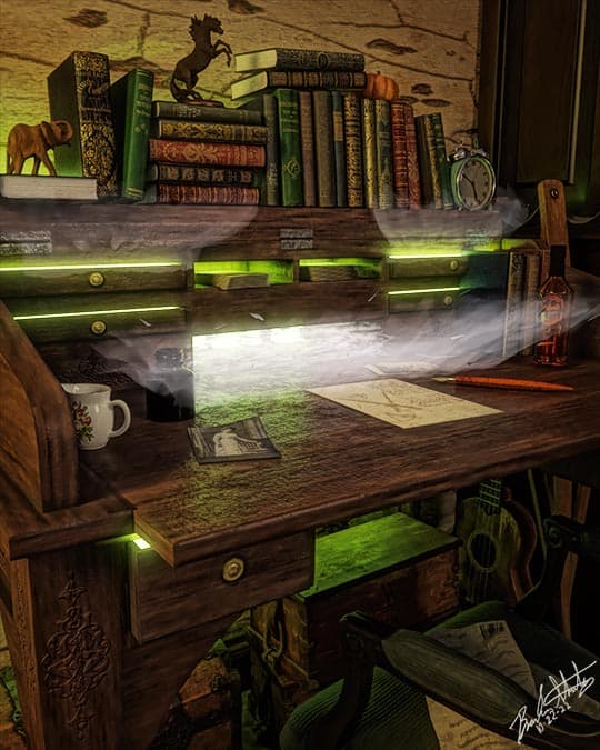 An antique desk glows with green lights and fog coming out of the drawers.
